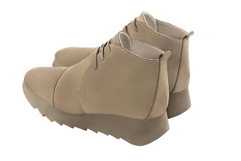 Tan beige women's ankle boots with laces at the front. Square toe. Low rubber soles. Rear view - Florence KOOIJMAN